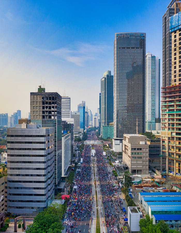 Skyline view of Jakarta with skyscrapers and bustling streets.